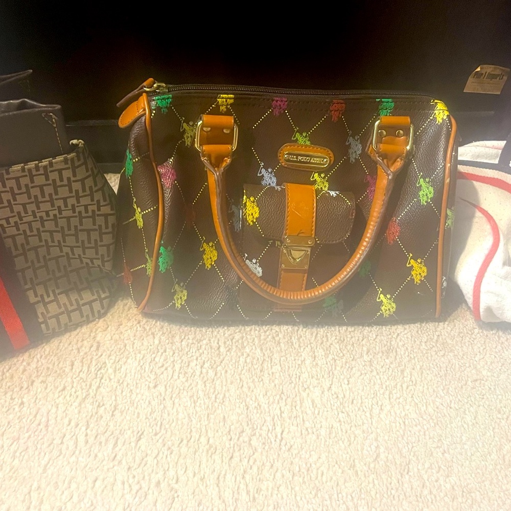 This is a trio of three different hand bags . Polo , Roxy , Tommy Hilfiger .